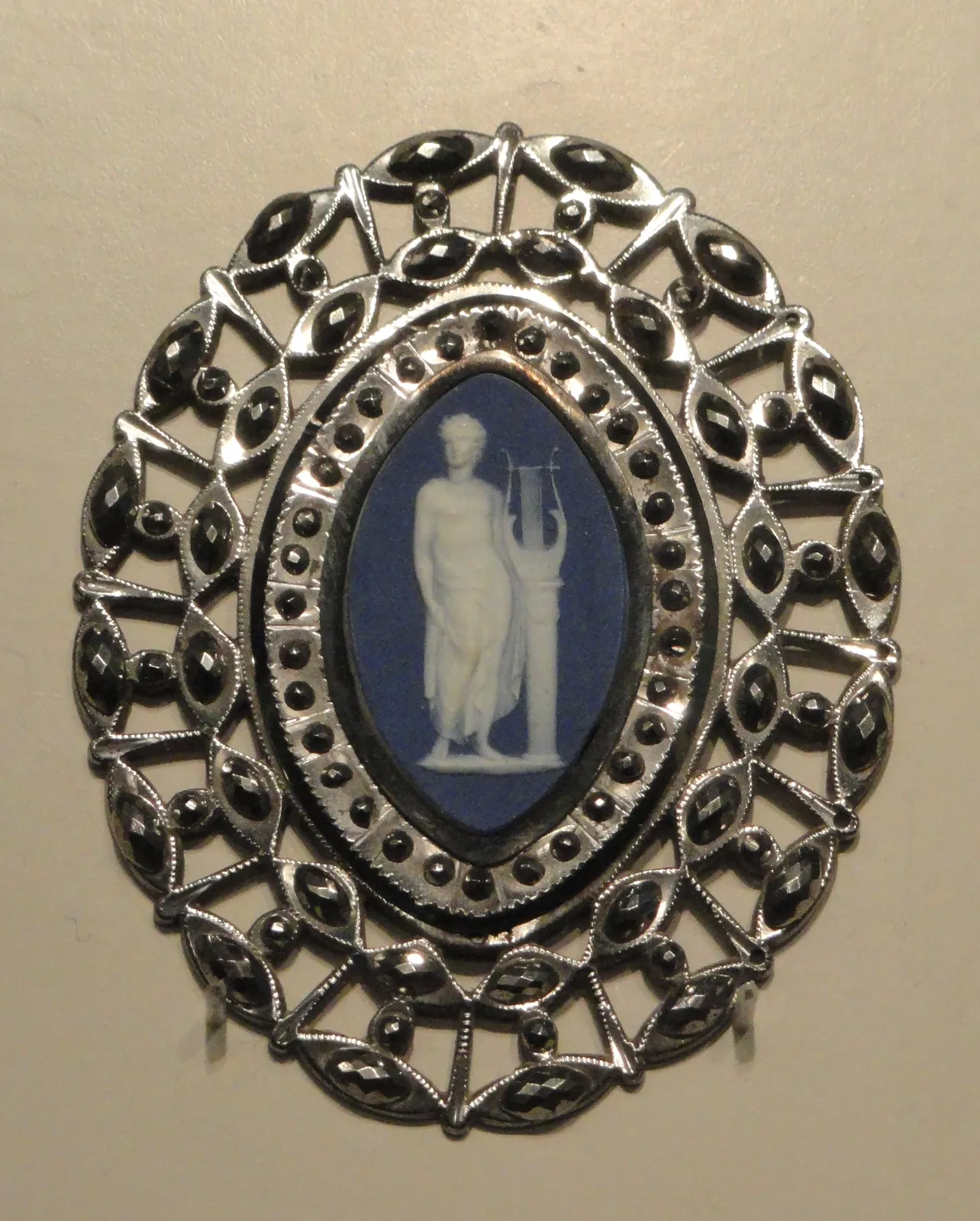 White Apollo with a lyre on a blue jasperware oval, openwork cut steel frame; Wedgwood, 1775/80; Art Institute of Chicago