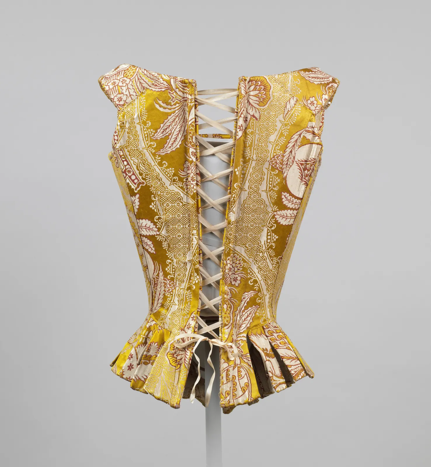 Back-laced silk stays with tabs below the waist; Italian, 1770s; The Met C.I.40.173.6a–e, catalogued as Corset
